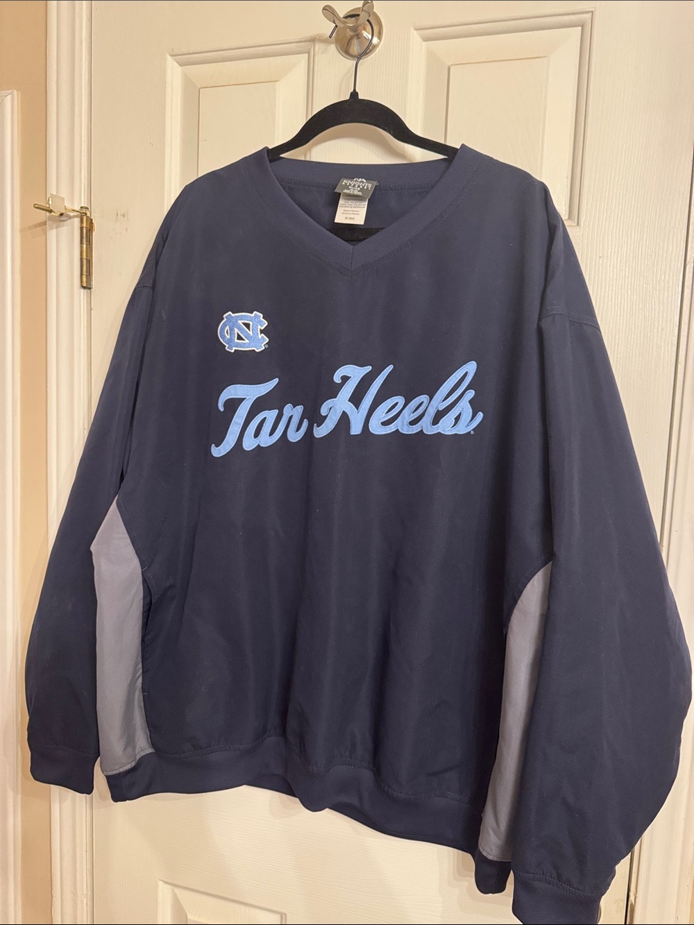 Knights Apparel Navy V-Neck Sweater with Carolina Blue Script and Gray Panels